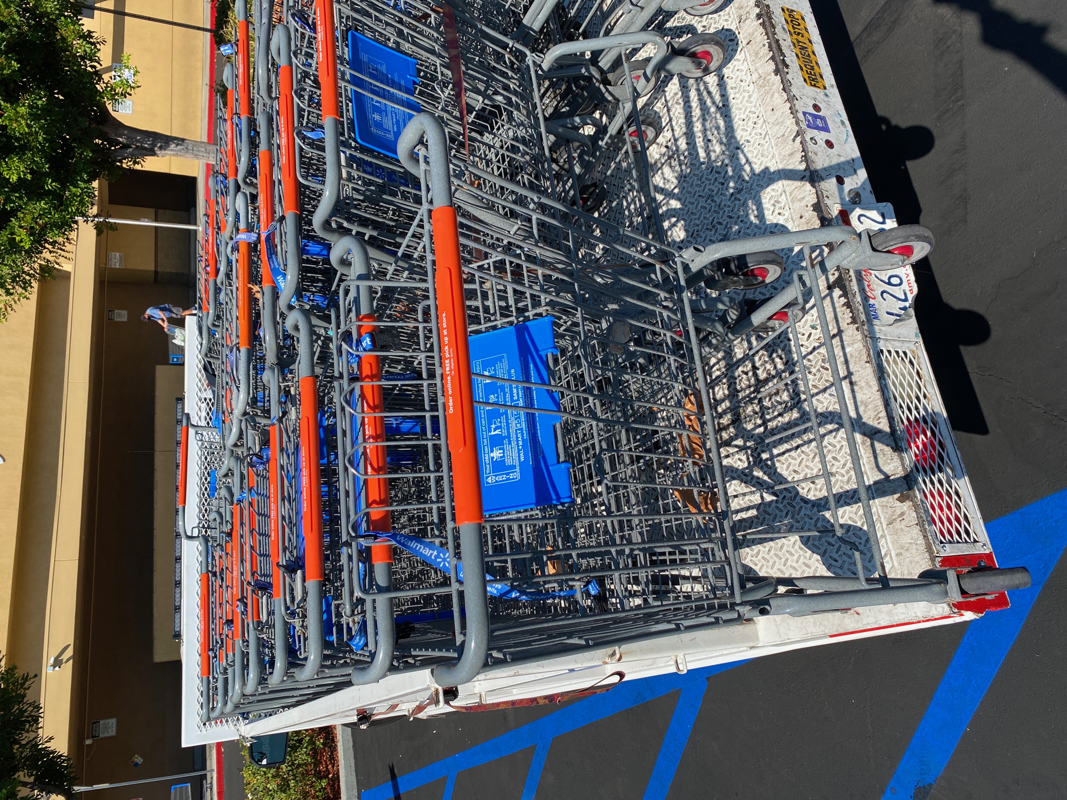 Shopping carts loaded on retrieval truck at a major retailer